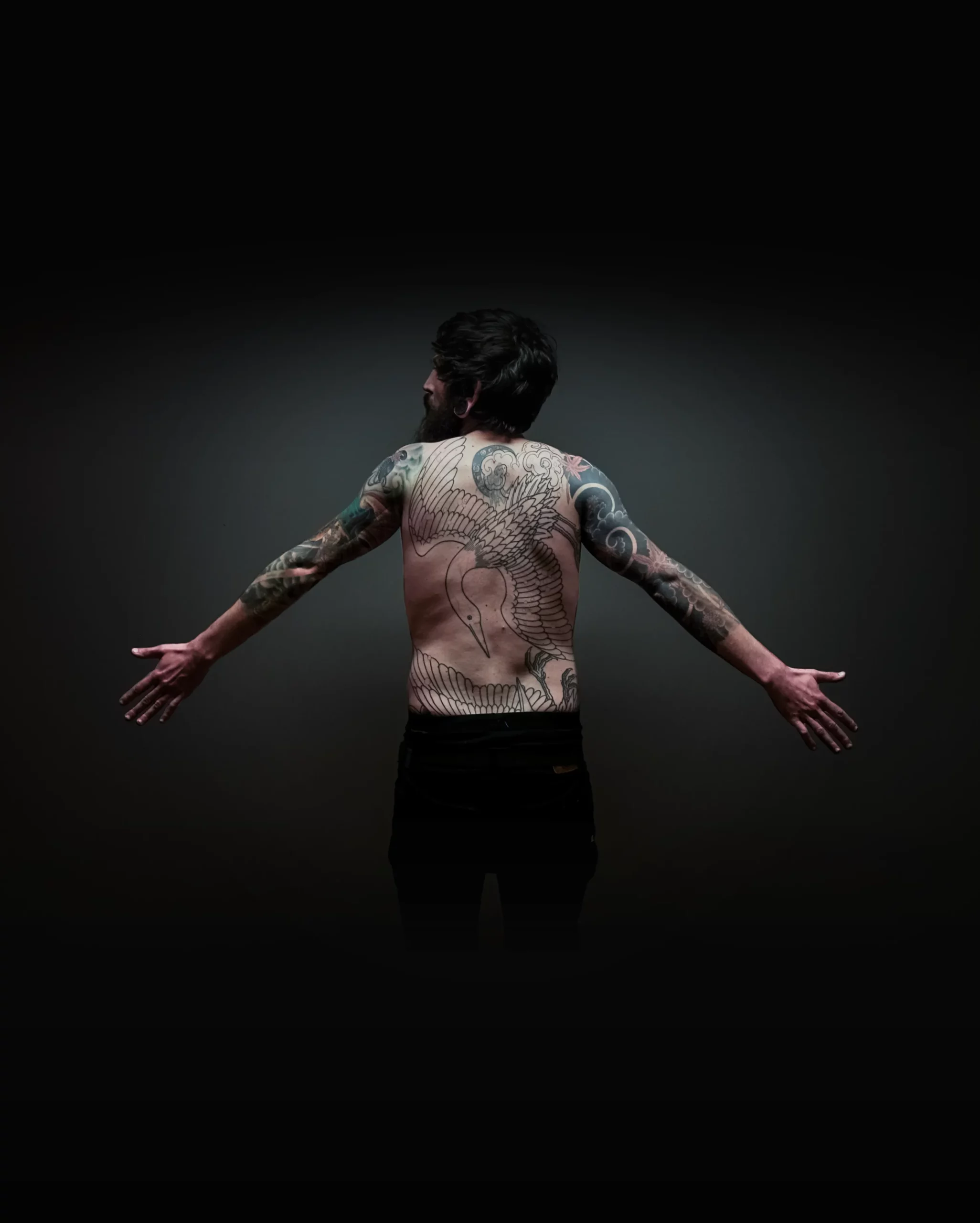 Photographie d'un homme tatoué
